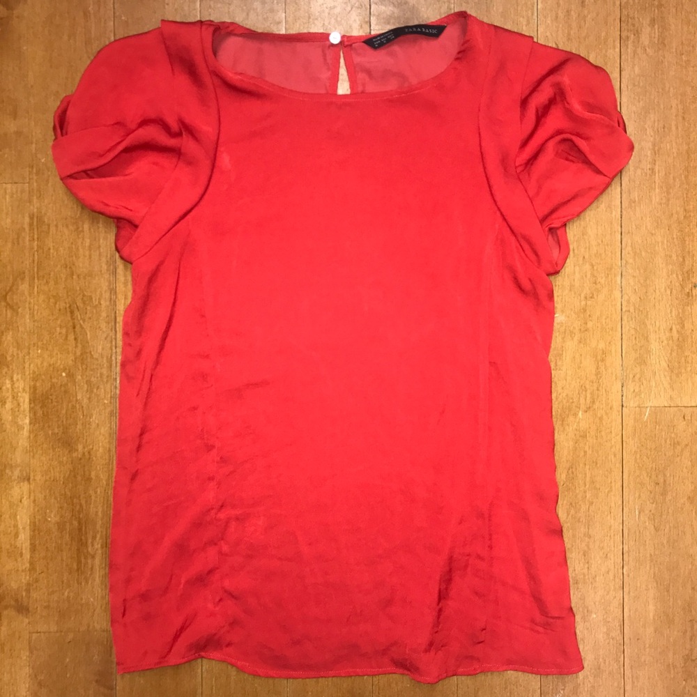 Red Zara blouse with detailed puffy sleeves. Size medium.